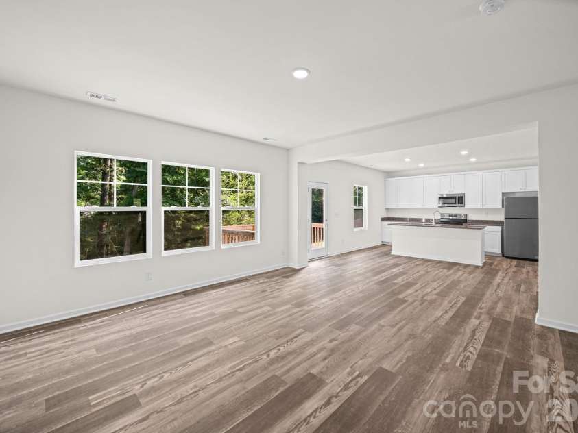 7809 Lane Drive, Charlotte, NC 28212.  MLS# CAR4395836, YatesRealty ID 40163. Great Room and Kitchen