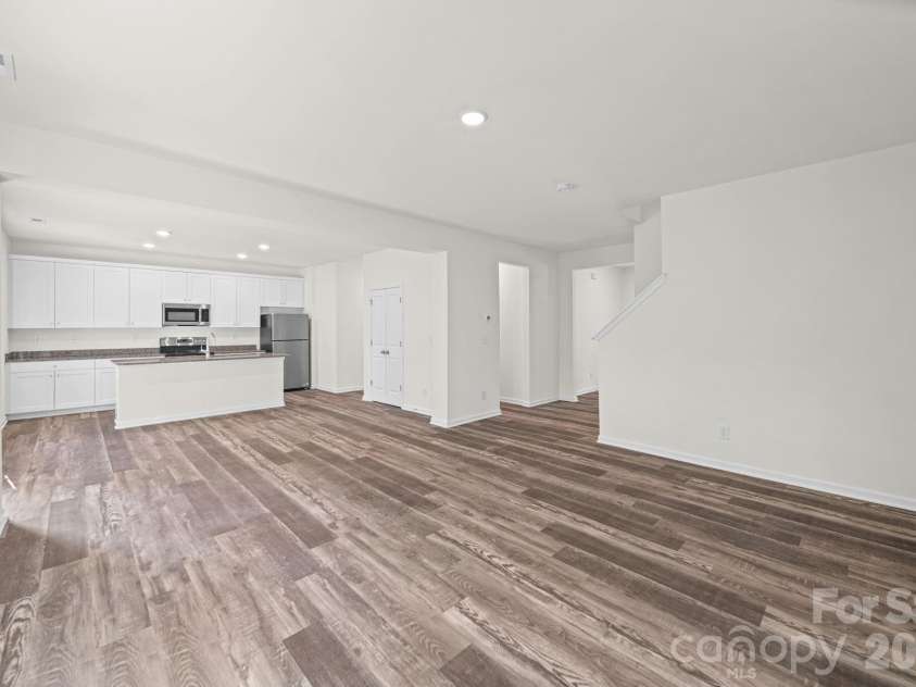 7809 Lane Drive, Charlotte, NC 28212.  MLS# CAR4395836, YatesRealty ID 40163. Great Room and Kitchen