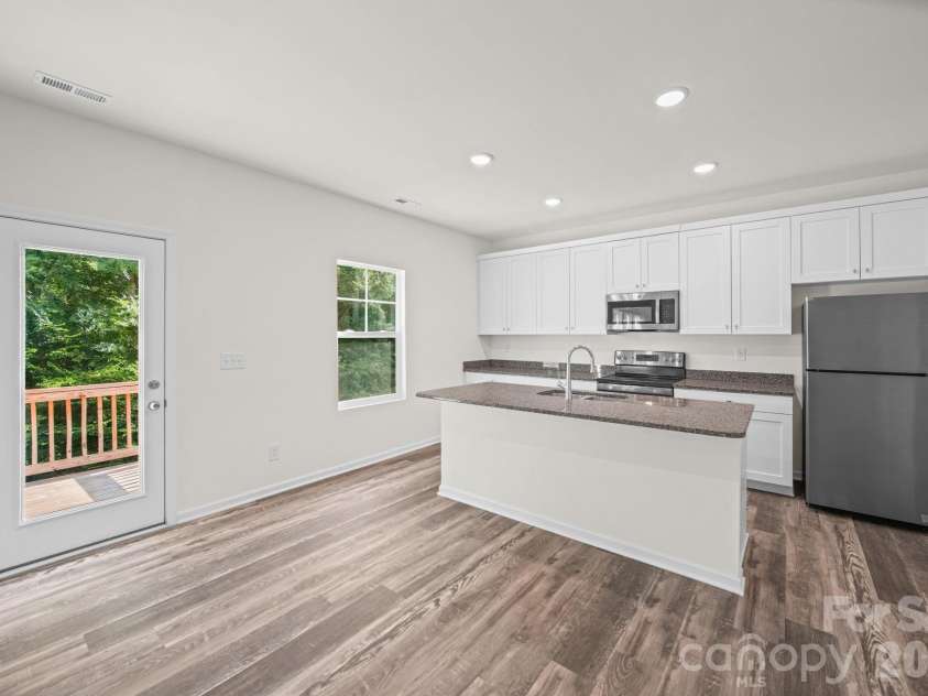7809 Lane Drive, Charlotte, NC 28212.  MLS# CAR4395836, YatesRealty ID 40163. Kitchen and Dining Room