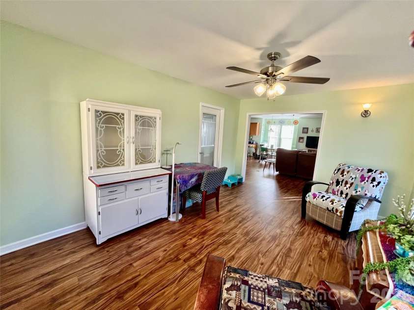 27 Gray Wolf Lane, Hendersonville, NC 28792.  MLS# CAR4285060, YatesRealty ID 4017. Living Room Opens to the Sunroom
