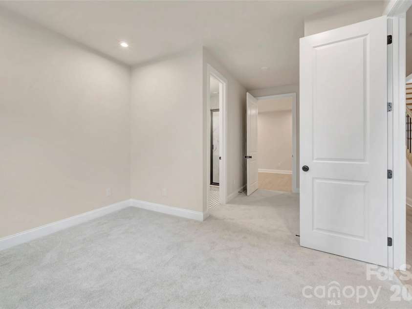 13009 Lucy Park Lane, Charlotte, NC 28277.  MLS# CAR4408613, YatesRealty ID 40179. First floor GenSmart Suite Bedroom