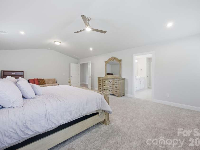 311 Coronado Avenue, Matthews, NC 28104.  MLS# CAR4400272, YatesRealty ID 40201. Large Primary with double entry doors, vaulted ceiling and primary en-suite.