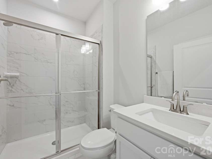 311 Coronado Avenue, Matthews, NC 28104.  MLS# CAR4400272, YatesRealty ID 40201. Main level guest full bath