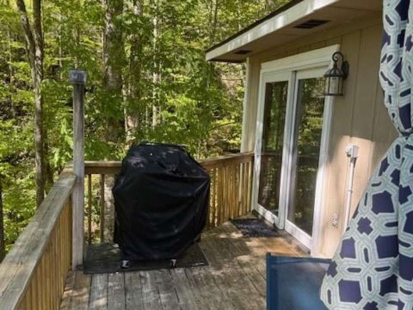 918 Plott Balsam Road, Maggie Valley, NC 28751.  MLS# CAR4383857, YatesRealty ID 40202. Rear Deck from Dining Room Patio Door