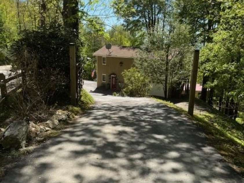 918 Plott Balsam Road, Maggie Valley, NC 28751.  MLS# CAR4383857, YatesRealty ID 40202. View looking down Driveway to Cabin