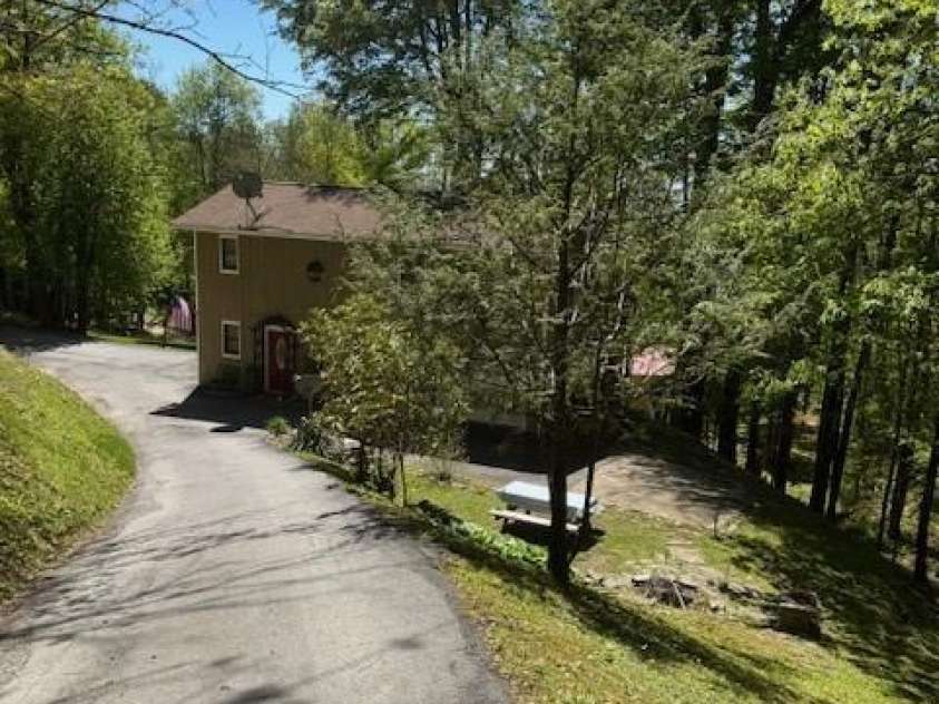 918 Plott Balsam Road, Maggie Valley, NC 28751.  MLS# CAR4383857, YatesRealty ID 40202. View looking down Driveway to Cabin