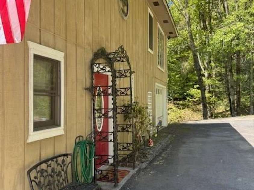 918 Plott Balsam Road, Maggie Valley, NC 28751.  MLS# CAR4383857, YatesRealty ID 40202. View of Front Elevation of Cabin