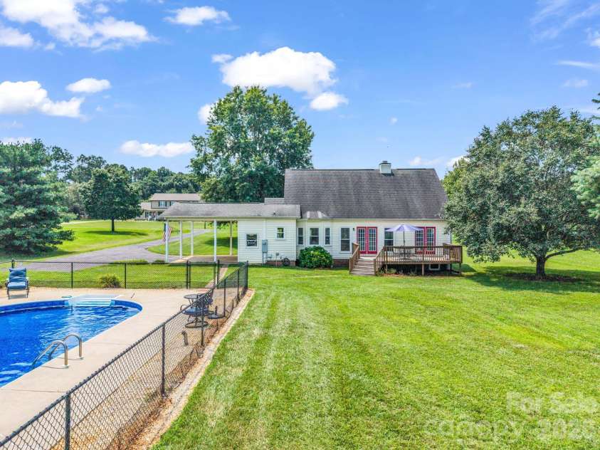 2778 Moose Gantt Trail, Crouse, NC 28033.  MLS# CAR4407300, YatesRealty ID 40211. Back view beside pool