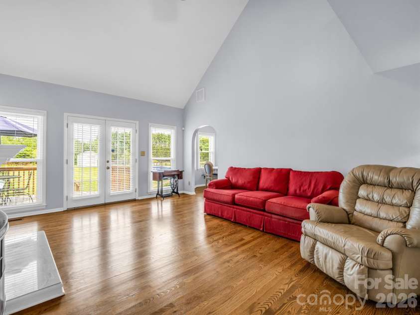 2778 Moose Gantt Trail, Crouse, NC 28033.  MLS# CAR4407300, YatesRealty ID 40211. Living room with french doors to back deck