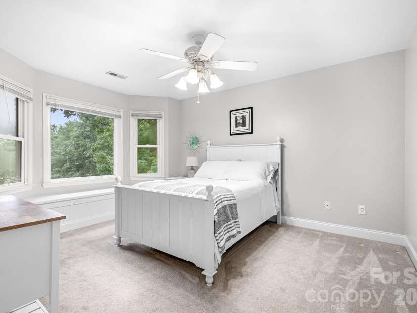 7048 Mariners Court, Tega Cay, SC 29708.  MLS# CAR4408357, YatesRealty ID 40235. Bedroom 2 - Built in window seat with storage