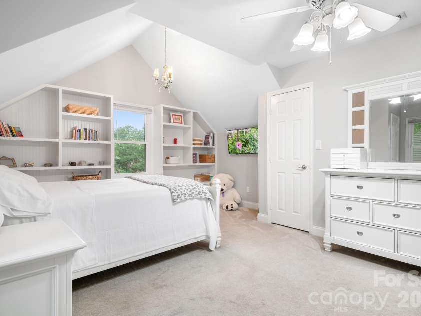 7048 Mariners Court, Tega Cay, SC 29708.  MLS# CAR4408357, YatesRealty ID 40235. Bedroom 4 - Built in shelving and window seat
