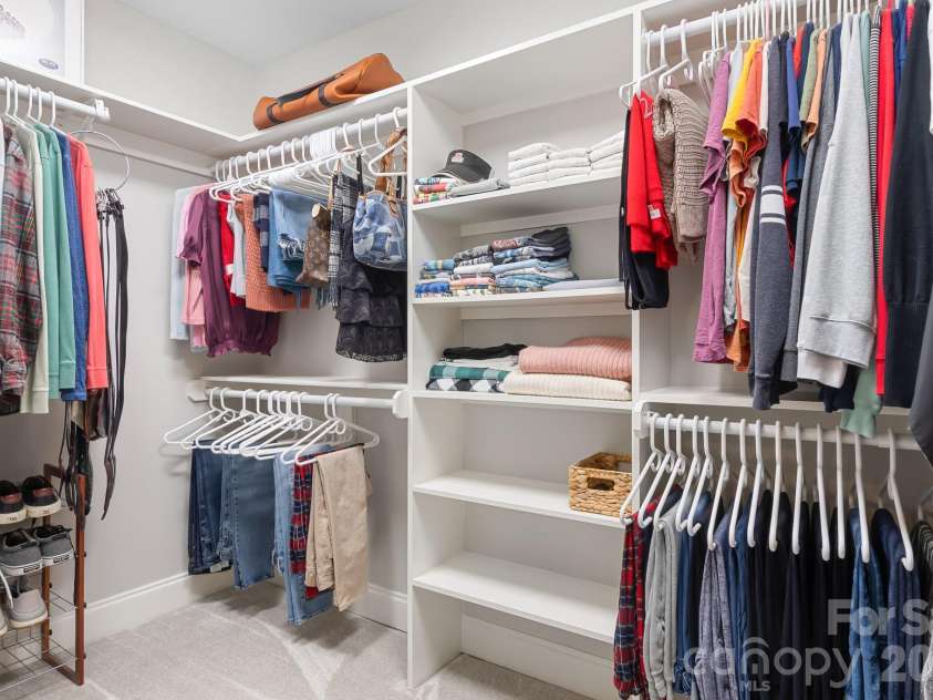 7048 Mariners Court, Tega Cay, SC 29708.  MLS# CAR4408357, YatesRealty ID 40235. Custom Closet in Primary Bedroom