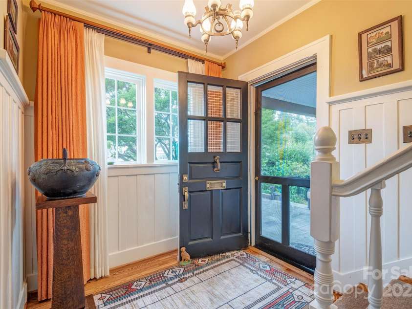 1 Evergreen Lane, Asheville, NC 28801.  MLS# CAR4302888, YatesRealty ID 40242. Front Foyer (chandelier in photo does not convey but has been replaced for showings)