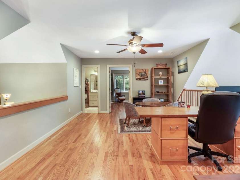 301 Gateway Drive, Hendersonville, NC 28739.  MLS# CAR4294263, YatesRealty ID 40247. Let's go upstairs! Welcome to the loft! The owner uses it for card games and an office. Straight ahead is a guest bedroom and full bath.