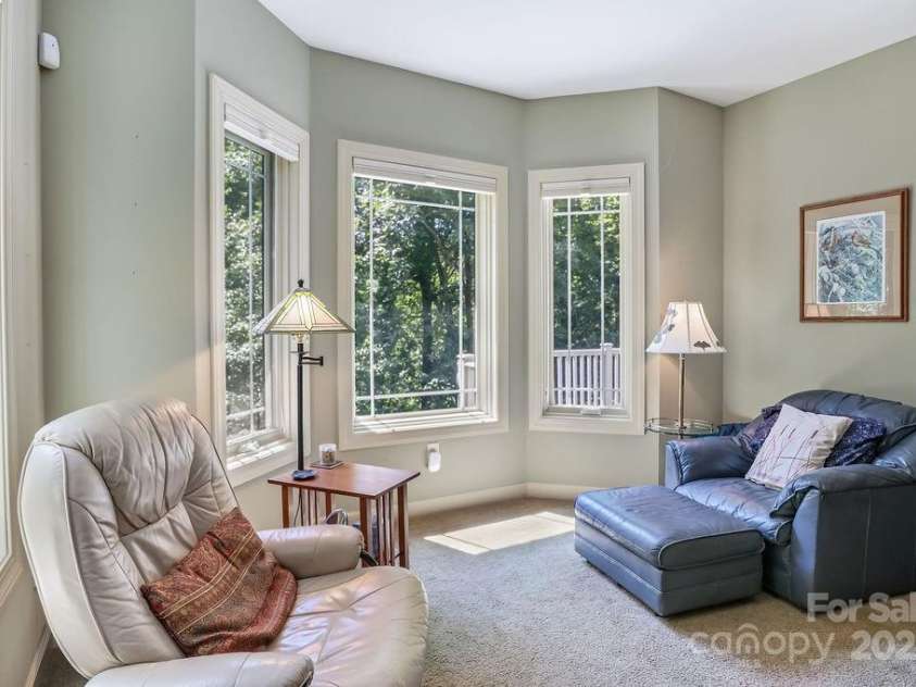 301 Gateway Drive, Hendersonville, NC 28739.  MLS# CAR4294263, YatesRealty ID 40247. The bay window sitting area is a great place to relax in the main-floor primary suite. 