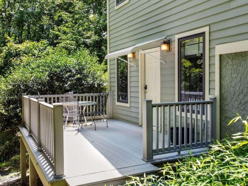 301 Gateway Drive, Hendersonville, NC 28739.  MLS# CAR4294263, YatesRealty ID 40247. The deck off of the media/entertainment room downstairs. 