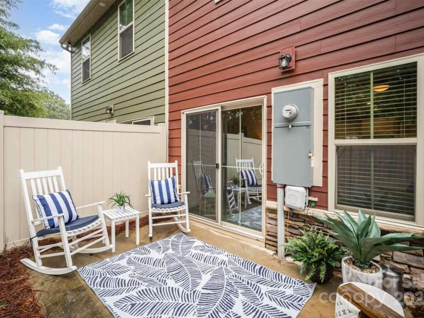407 Park Meadows Drive, Matthews, NC 28104.  MLS# CAR4287821, YatesRealty ID 40250. Cozy patio offers a little serenity for those morning coffees or afternoon cocktails.