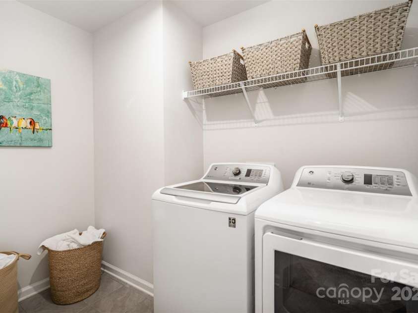 407 Park Meadows Drive, Matthews, NC 28104.  MLS# CAR4287821, YatesRealty ID 40250. No Laundry closet here.  This is a ROOM!  Loads of space for organizing your work area, or storing extra household items.