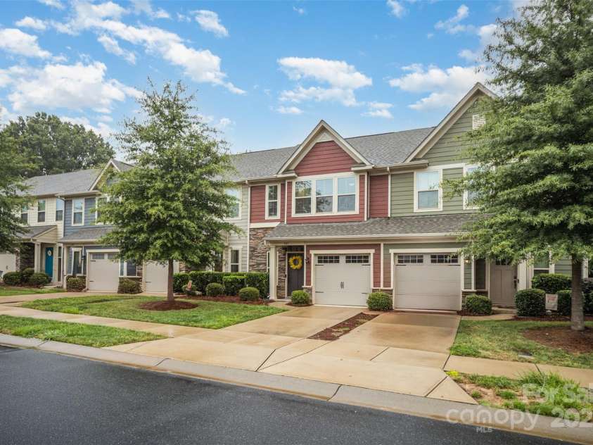 407 Park Meadows Drive, Matthews, NC 28104.  MLS# CAR4287821, YatesRealty ID 40250. The mature tree in the front offers additional privacy and natural beauty to our featured property.
