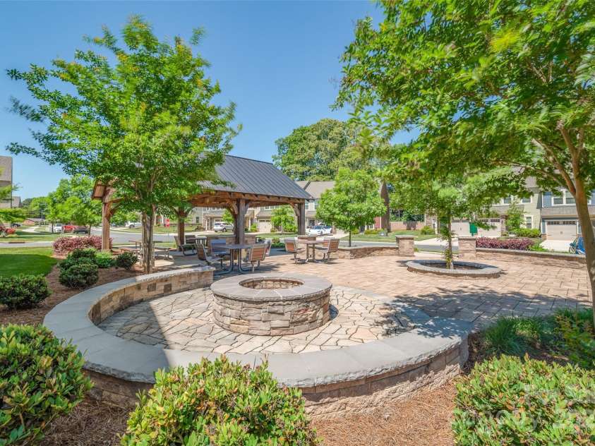 407 Park Meadows Drive, Matthews, NC 28104.  MLS# CAR4287821, YatesRealty ID 40250. The neighborhood pavilion offers seating for larger gatherings and a fire pit to enjoy on those cooler evenings.