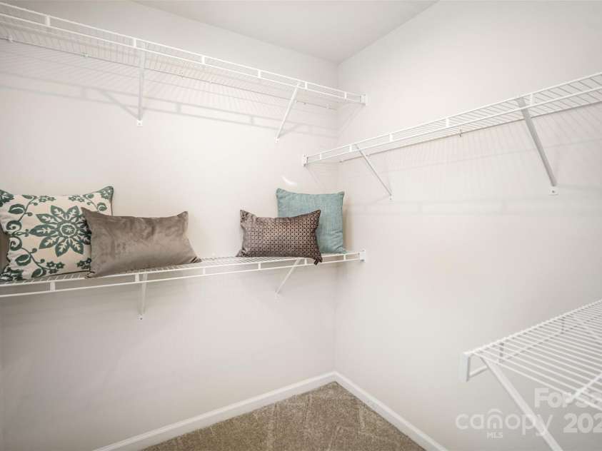 407 Park Meadows Drive, Matthews, NC 28104.  MLS# CAR4287821, YatesRealty ID 40250. The primary's walk-in also has a window (not shown) to the left of this shot.  More natural light to appreciate in this thoughtful design.