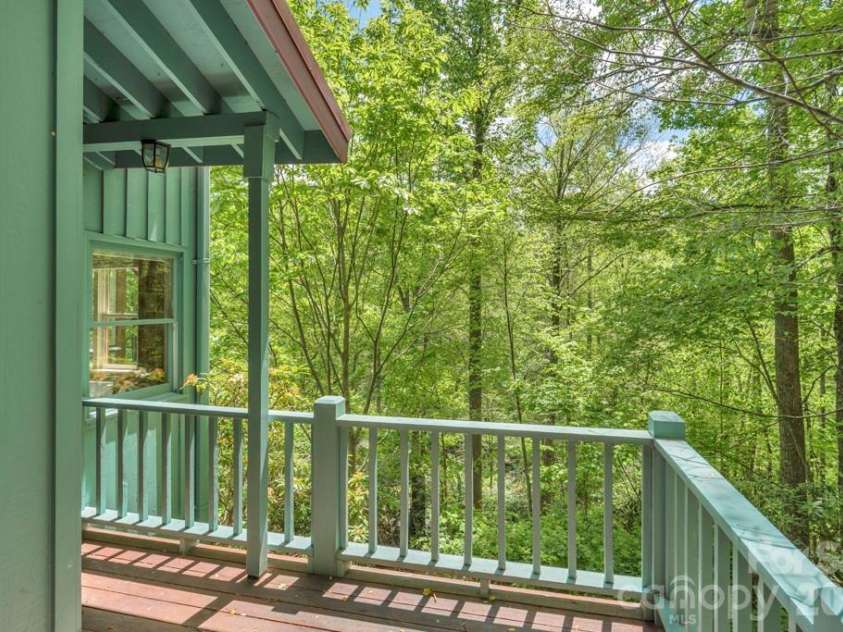 1590 Shulls Mill Road, Boone, NC 28607.  MLS# CAR4389715, YatesRealty ID 40251. Deck off lower-level studio bedroom suite bath