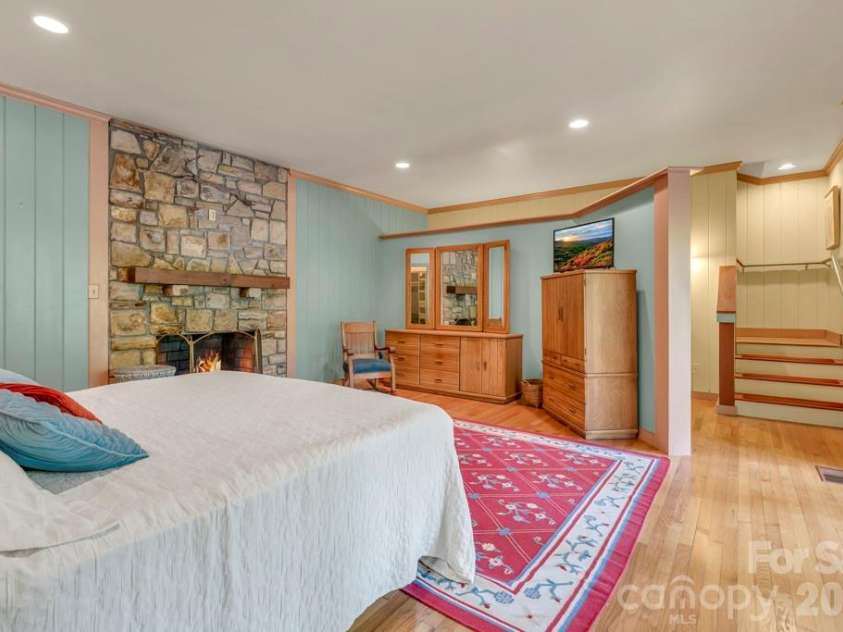 1590 Shulls Mill Road, Boone, NC 28607.  MLS# CAR4389715, YatesRealty ID 40251. Lower-level studio bedroom suite - fire added digitally