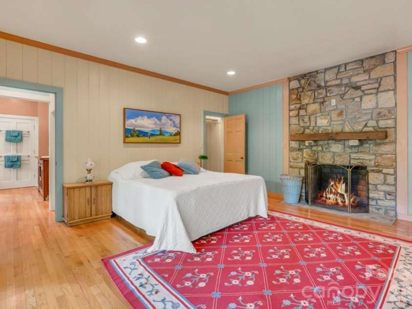 1590 Shulls Mill Road, Boone, NC 28607.  MLS# CAR4389715, YatesRealty ID 40251. Lower-level studio bedroom suite- spacious and open! Fire added digitally