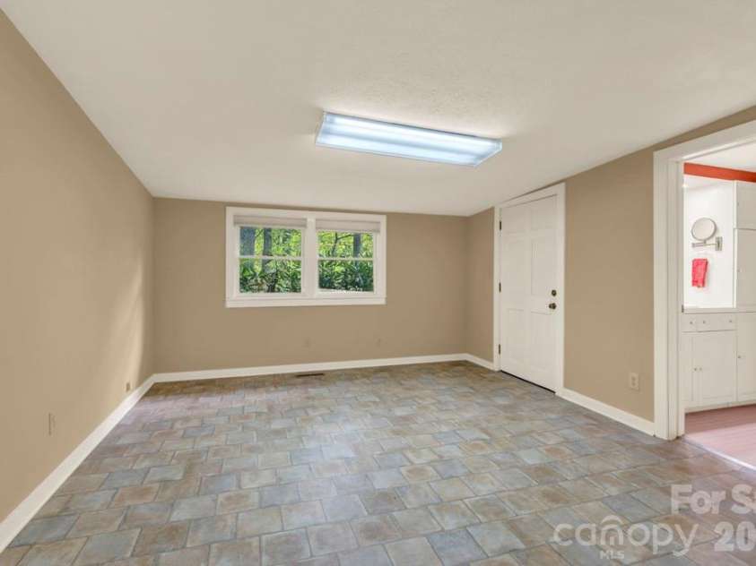 1590 Shulls Mill Road, Boone, NC 28607.  MLS# CAR4389715, YatesRealty ID 40251. Main-level bedroom suite