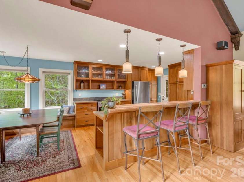 1590 Shulls Mill Road, Boone, NC 28607.  MLS# CAR4389715, YatesRealty ID 40251. Main-level kitchen & dining, with bar seating, open to the living space!
