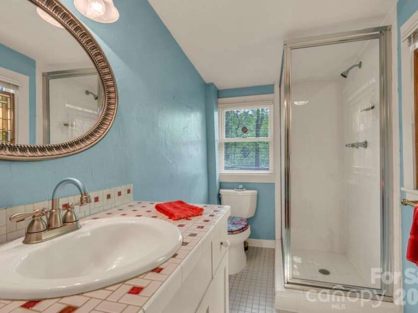 1590 Shulls Mill Road, Boone, NC 28607.  MLS# CAR4389715, YatesRealty ID 40251. Main-level primary suite bath