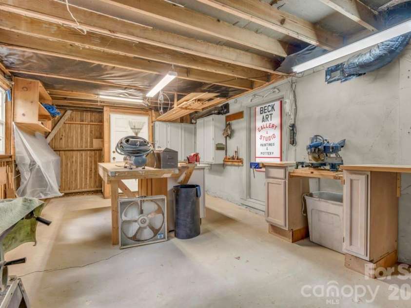 1590 Shulls Mill Road, Boone, NC 28607.  MLS# CAR4389715, YatesRealty ID 40251. Unfinished basement workshop