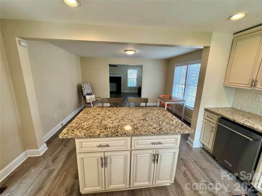 205 Tournament Drive, Concord, NC 28025.  MLS# CAR4407976, YatesRealty ID 40257. Kitchen looking into the dining and living room