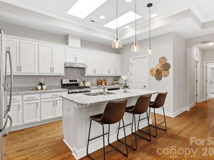 2106 Epworth Court, Waxhaw, NC 28173.  MLS# CAR4356029, YatesRealty ID 4026. Kitchen with island and skylights