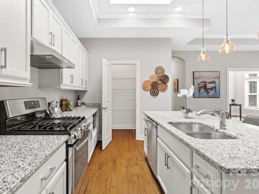 2106 Epworth Court, Waxhaw, NC 28173.  MLS# CAR4356029, YatesRealty ID 4026. Kitchen with island, SS appliances & walk-in pantry