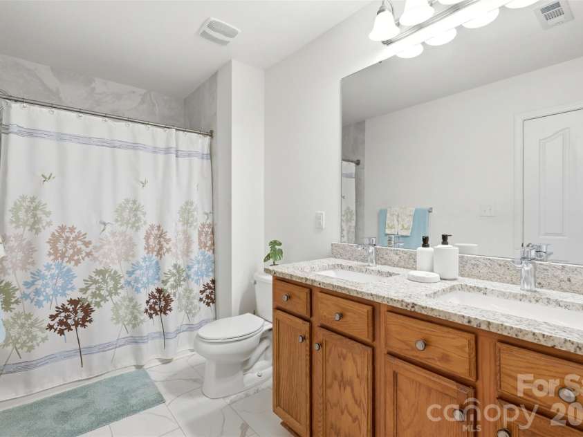 1112 Marcus Street, Indian Land, SC 29707.  MLS# CAR4403014, YatesRealty ID 40273. Primary Bathroom with tiled stand-up shower