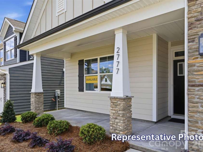 128 Swing Way, Troutman, NC 28166.  MLS# CAR4391618, YatesRealty ID 40277. Front porch