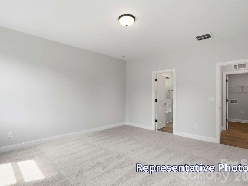 128 Swing Way, Troutman, NC 28166.  MLS# CAR4391618, YatesRealty ID 40277. Primary Bedroom
