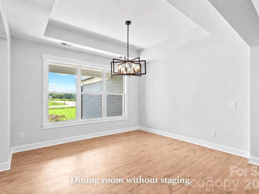 1205 Coppergate Drive, Salisbury, NC 28147.  MLS# CAR4406348, YatesRealty ID 40304. Dining with tray ceiling. (Shows Dining not virtually staged.)