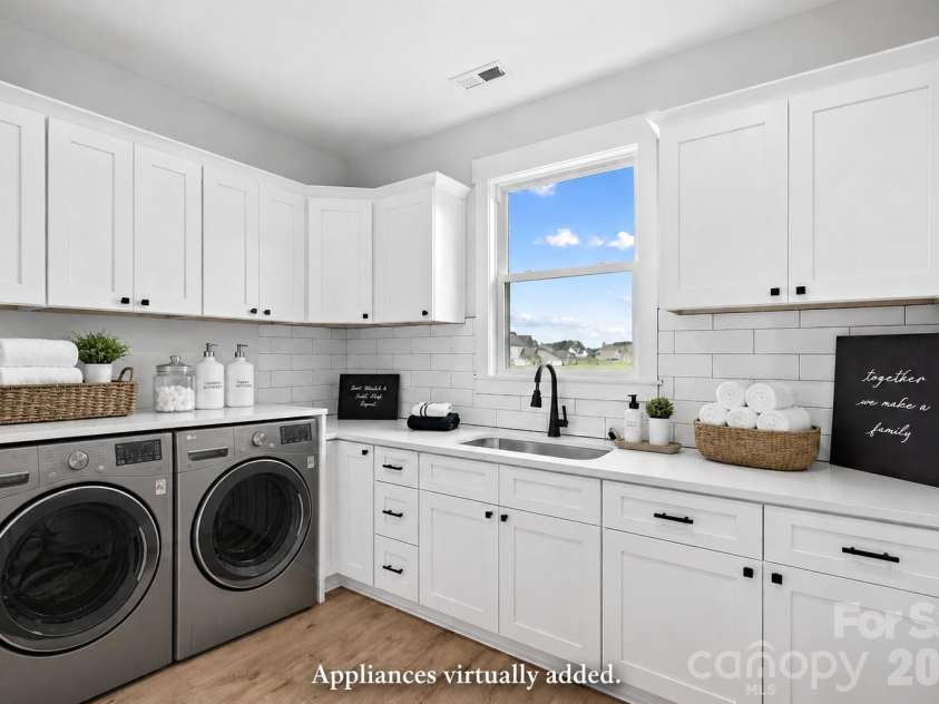 1205 Coppergate Drive, Salisbury, NC 28147.  MLS# CAR4406348, YatesRealty ID 40304. Wow! Laundry Room has more cabinets than some kitchens. (Appliances virtually staged.)