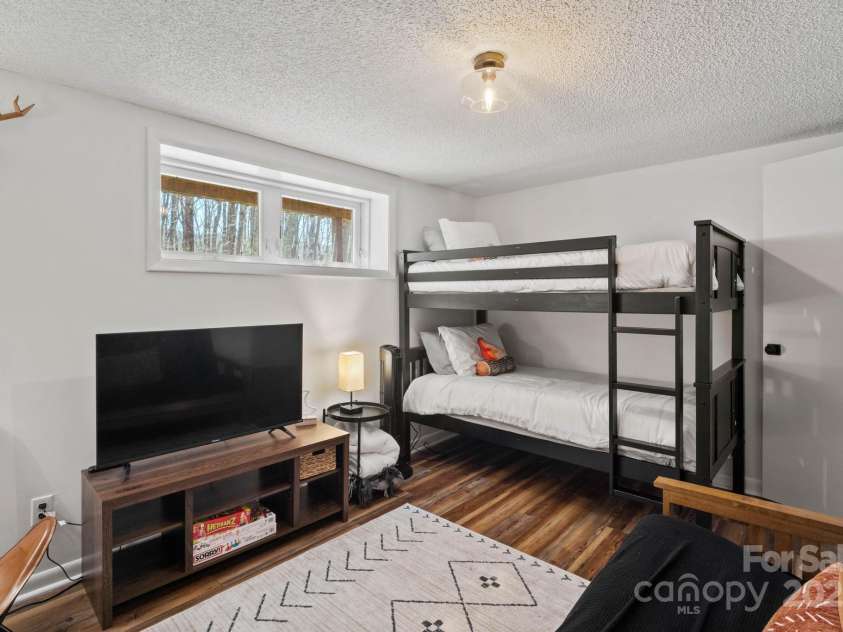 721 Pine Ridge Road, Beech Mountain, NC 28604.  MLS# CAR4242595, YatesRealty ID 4033. Bunk Room/Guest Bedroom #3 on Lower Level