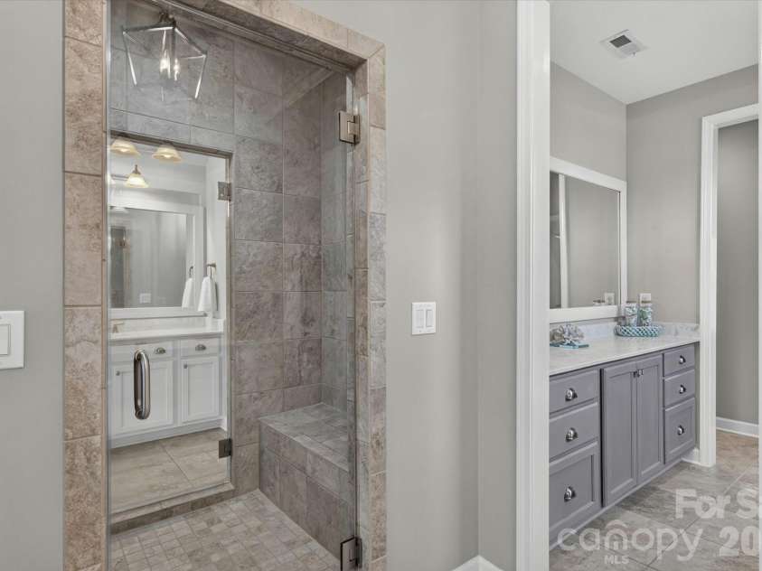 1348 Shinnecock Lane, Fort Mill, SC 29707.  MLS# CAR4397330, YatesRealty ID 40362. Spacious steam shower with bench can be entered from either side