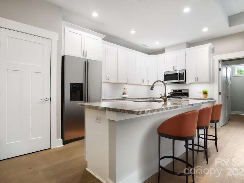 48 Creekside View Drive, Asheville, NC 28804.  MLS# CAR4046496, YatesRealty ID 4040. Virtually staged as there is no refrigerator in the home. 