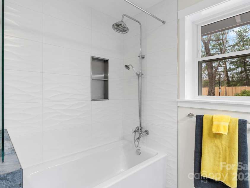 241 Pole Creasman Road, Asheville, NC 28806.  MLS# CAR4199603, YatesRealty ID 4043. Bathroom w shower over soaking tub