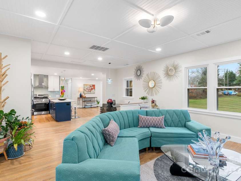 241 Pole Creasman Road, Asheville, NC 28806.  MLS# CAR4199603, YatesRealty ID 4043. Family room looking into dining and kitchen area