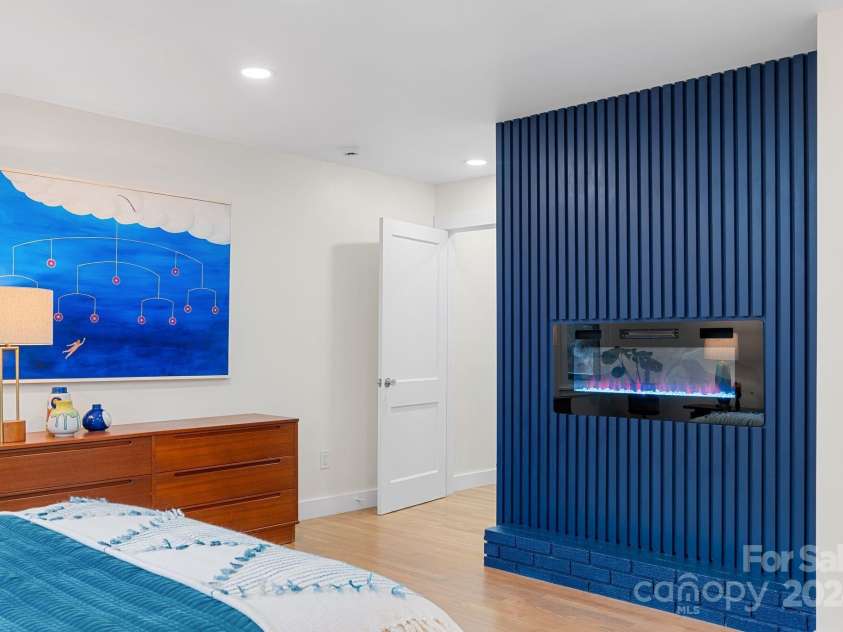 241 Pole Creasman Road, Asheville, NC 28806.  MLS# CAR4199603, YatesRealty ID 4043. Primary bedroom fireplace