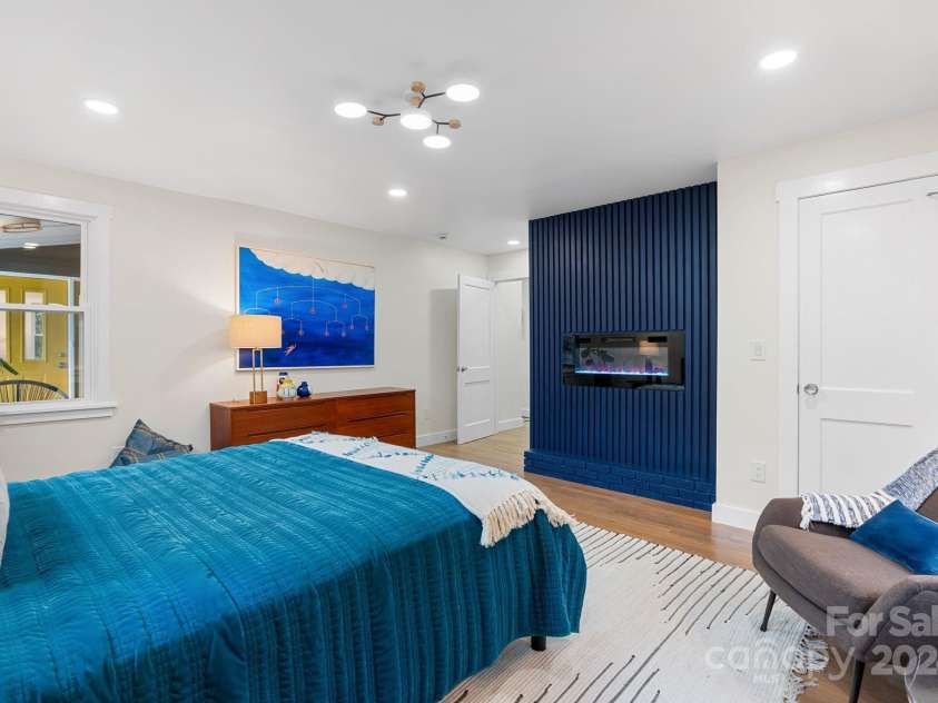 241 Pole Creasman Road, Asheville, NC 28806.  MLS# CAR4199603, YatesRealty ID 4043. Primary Bedroom racing the fireplace