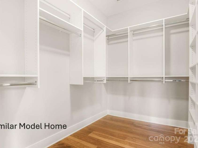 93 Creekside View Drive, Asheville, NC 28804.  MLS# CAR4328429, YatesRealty ID 4044. Spacious walk-in closet featuring custom built-ins for easy storage