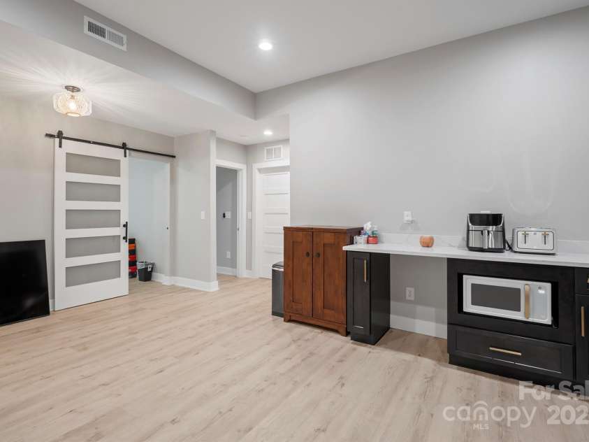685 Knollcrest Drive, Concord, NC 28025.  MLS# CAR4256189, YatesRealty ID 4045. Kitchenette in finished basement