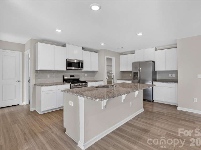 1503 Forkhorn Drive, Monroe, NC 28110.  MLS# CAR4409637, YatesRealty ID 40461. Island with Seating